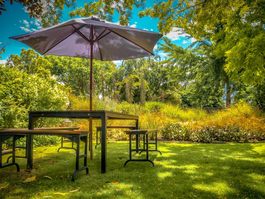 Garden furniture in shadow of backyard